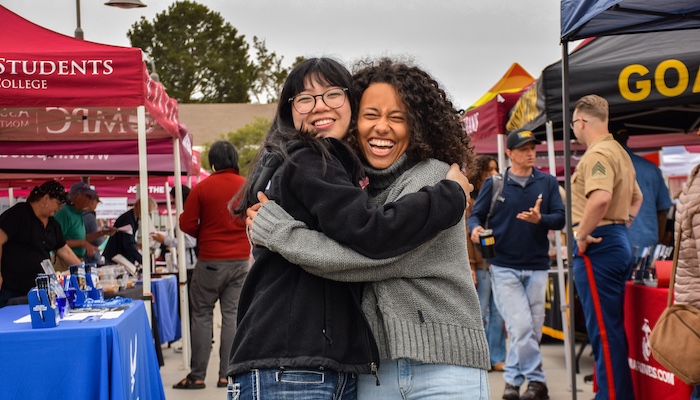 Two MPC Students excited and hugging