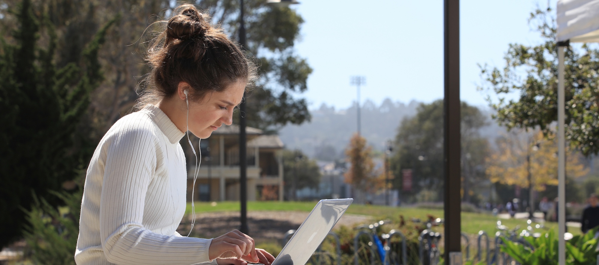 Student thinking while working on computer