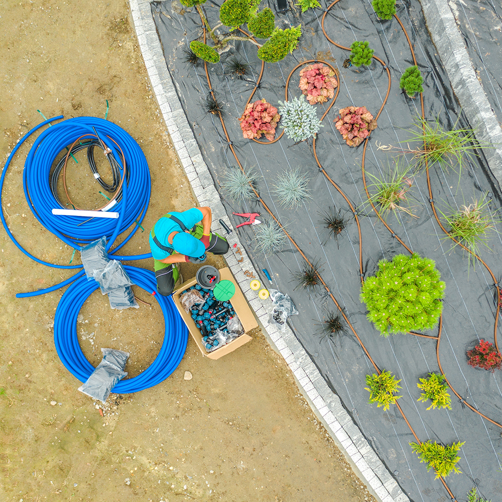 Landscape architect working on irrigation