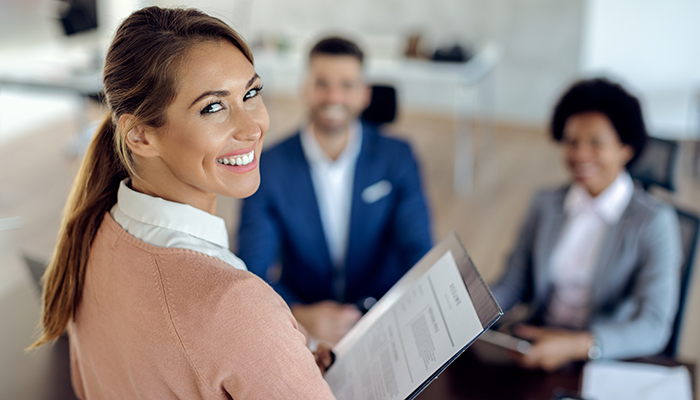 Interview gives a big smile before starting her interview