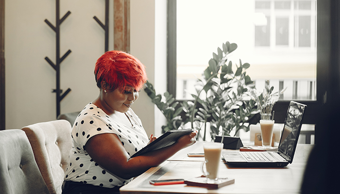 Professional dressed office administrator works on her to-do list