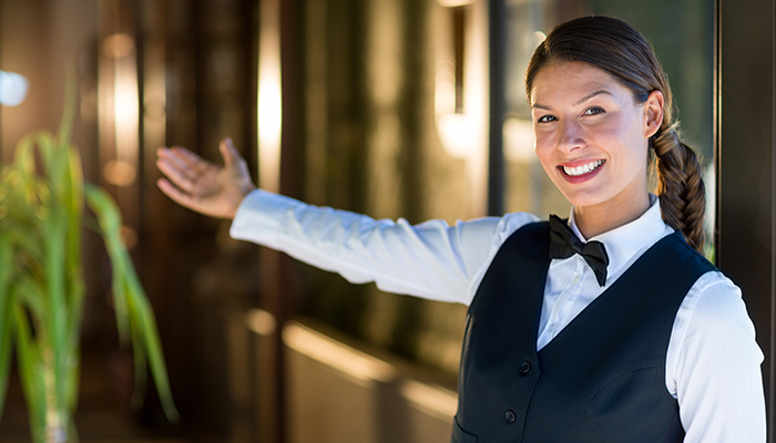 Concierge greets guests at hotel