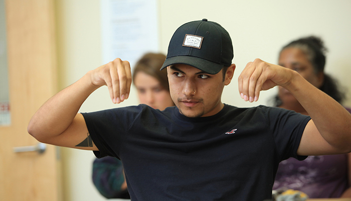 MPC ASL student practices new vocab words during class