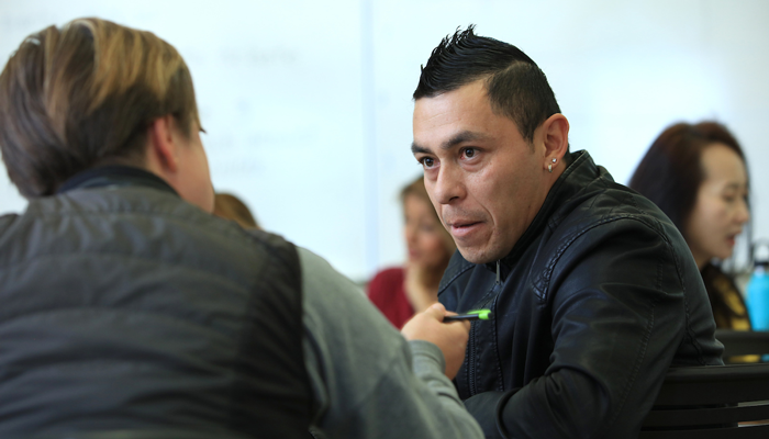 ESL student works on speaking skills during class