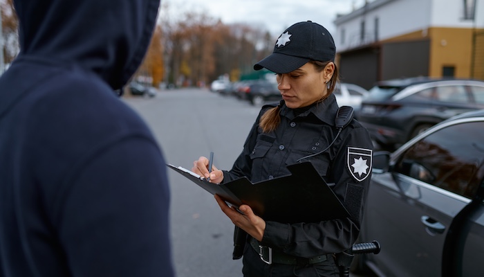 Police Officer Issuing Traffic Ticket