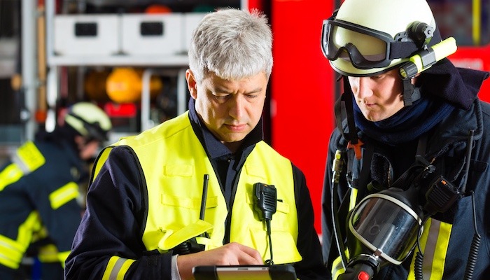 Firefighter Speaking with Fire Officer