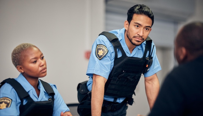 Two Police Officers Interrogating Suspect