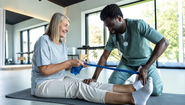 Physical Therapist Assisting Patient