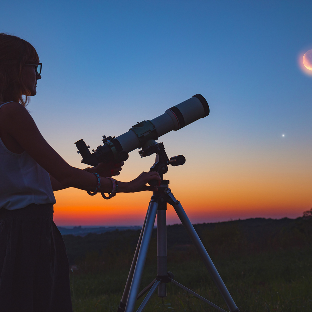 Person Viewing Night Sky with Telescope