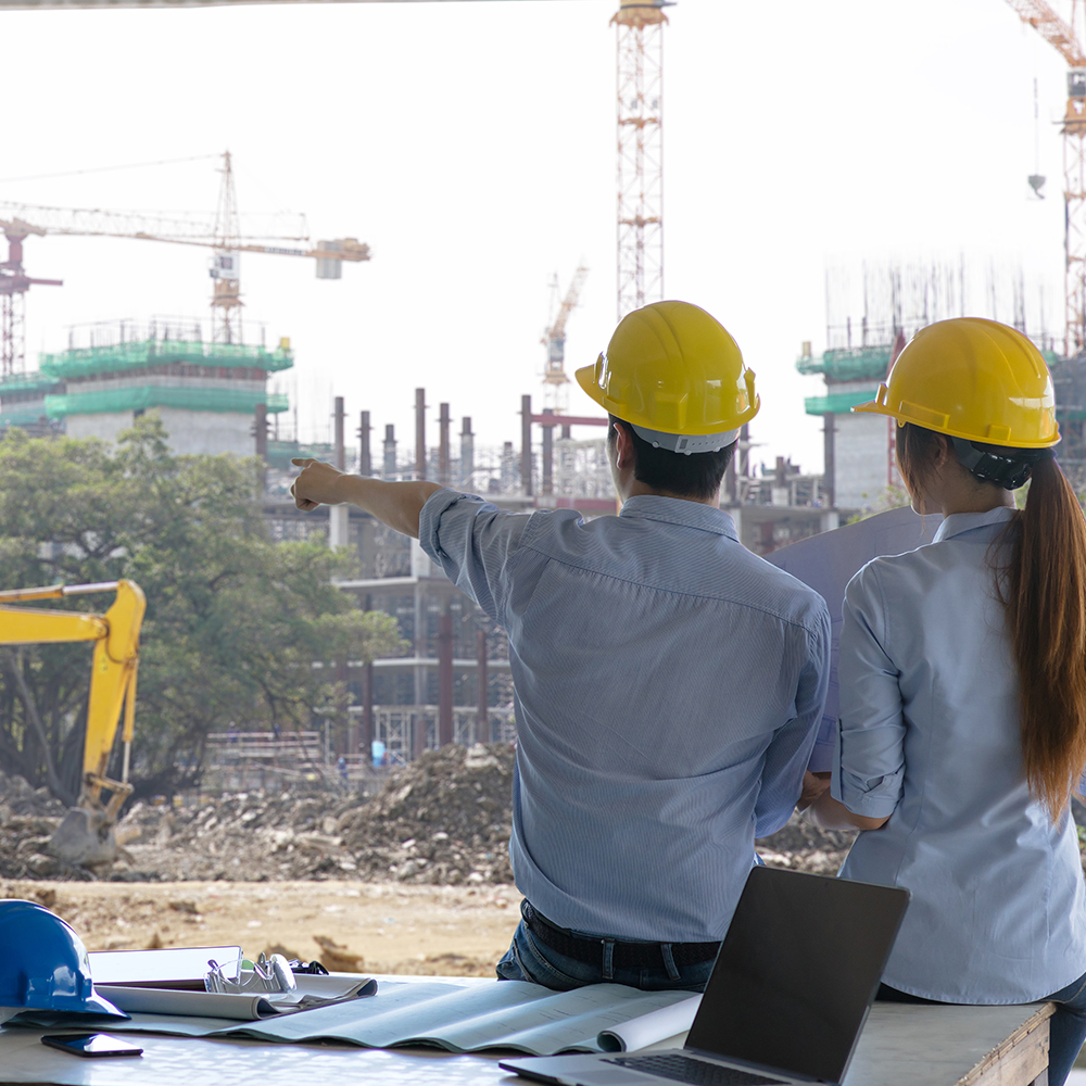 Engineers evaluate building construction on site