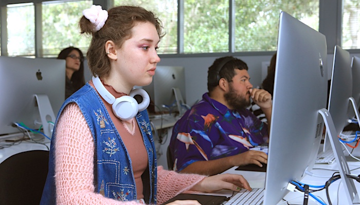 Graphic Arts Student Working on Computer in Class