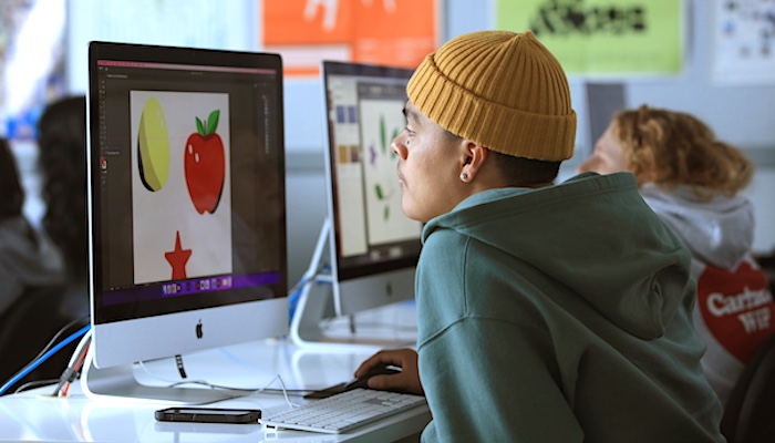 Graphic Arts Student Working on Computer in Class