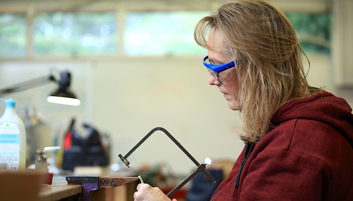 Jewelry & Metal Arts Student Sawing Project in Vise