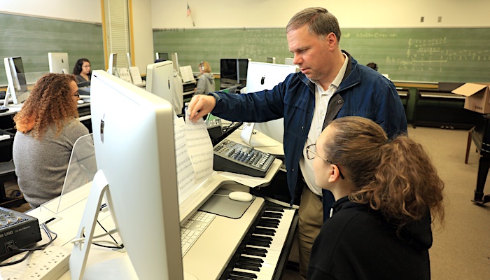 Music Student In Class Listening to Instructor