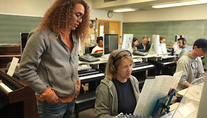 Music Student In Class Listening to Instructor