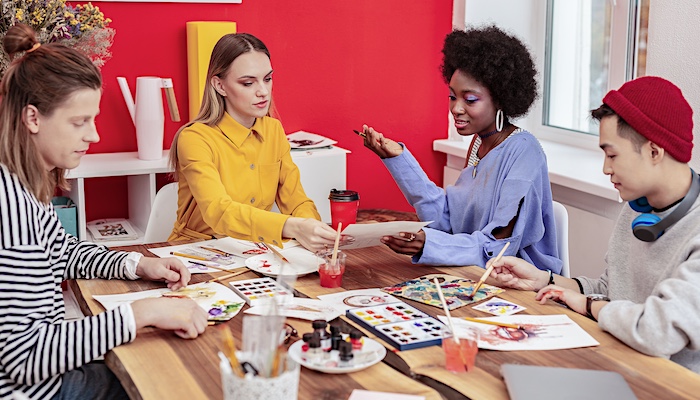 Group of People Painting Together in Class