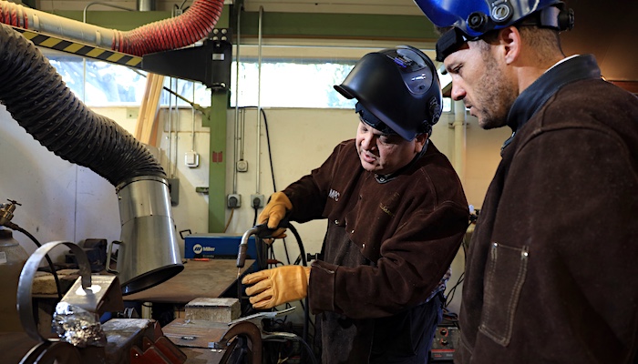 MPC Student Learning How to Weld from Instructor in Class