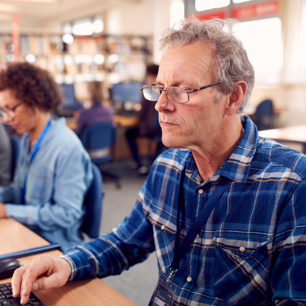 Senior in Class Learning How to Use Computer