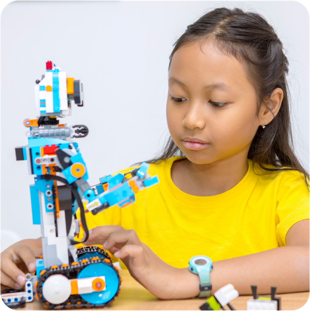 Child building lego robot