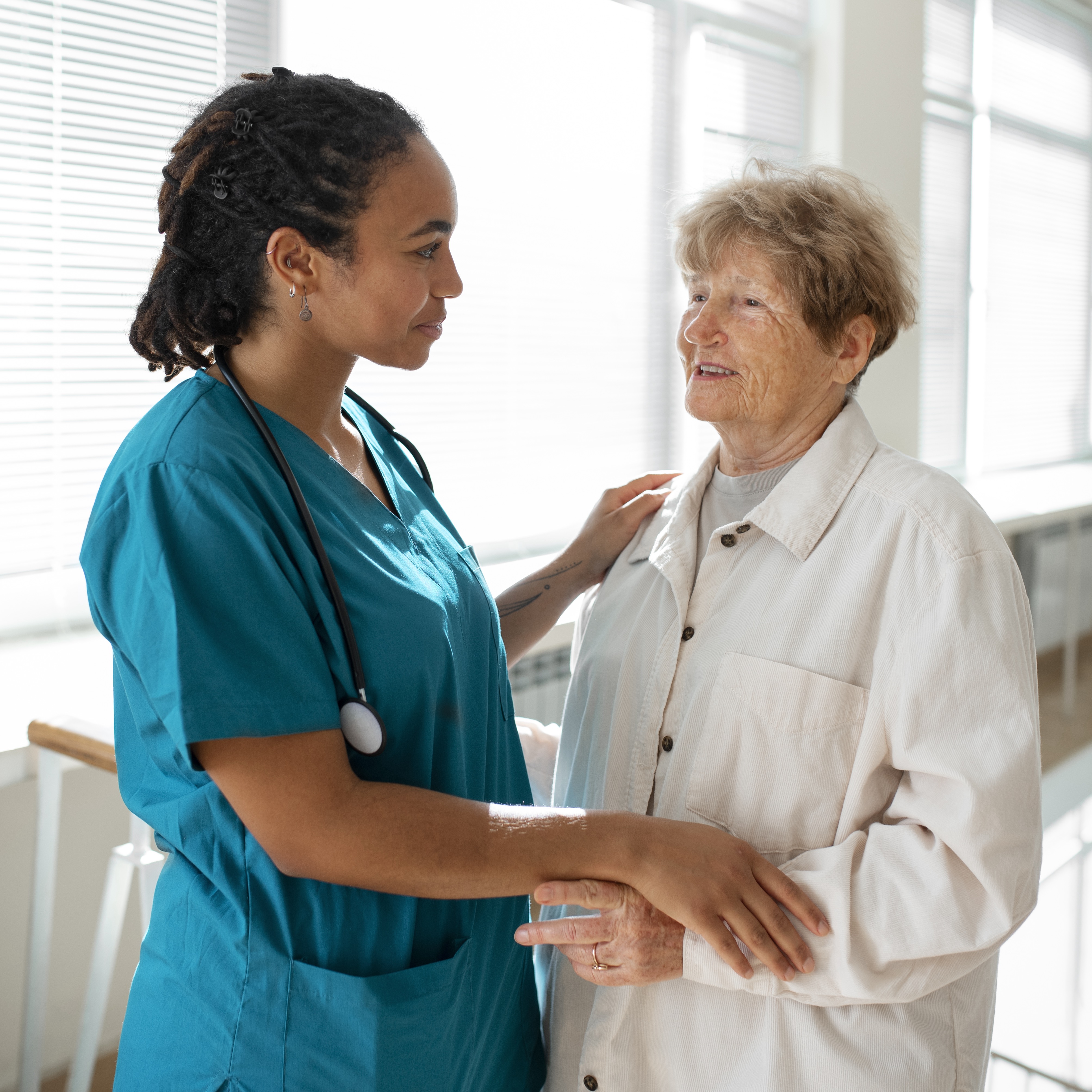 Community Health Care Worker Speaking with Older Patient