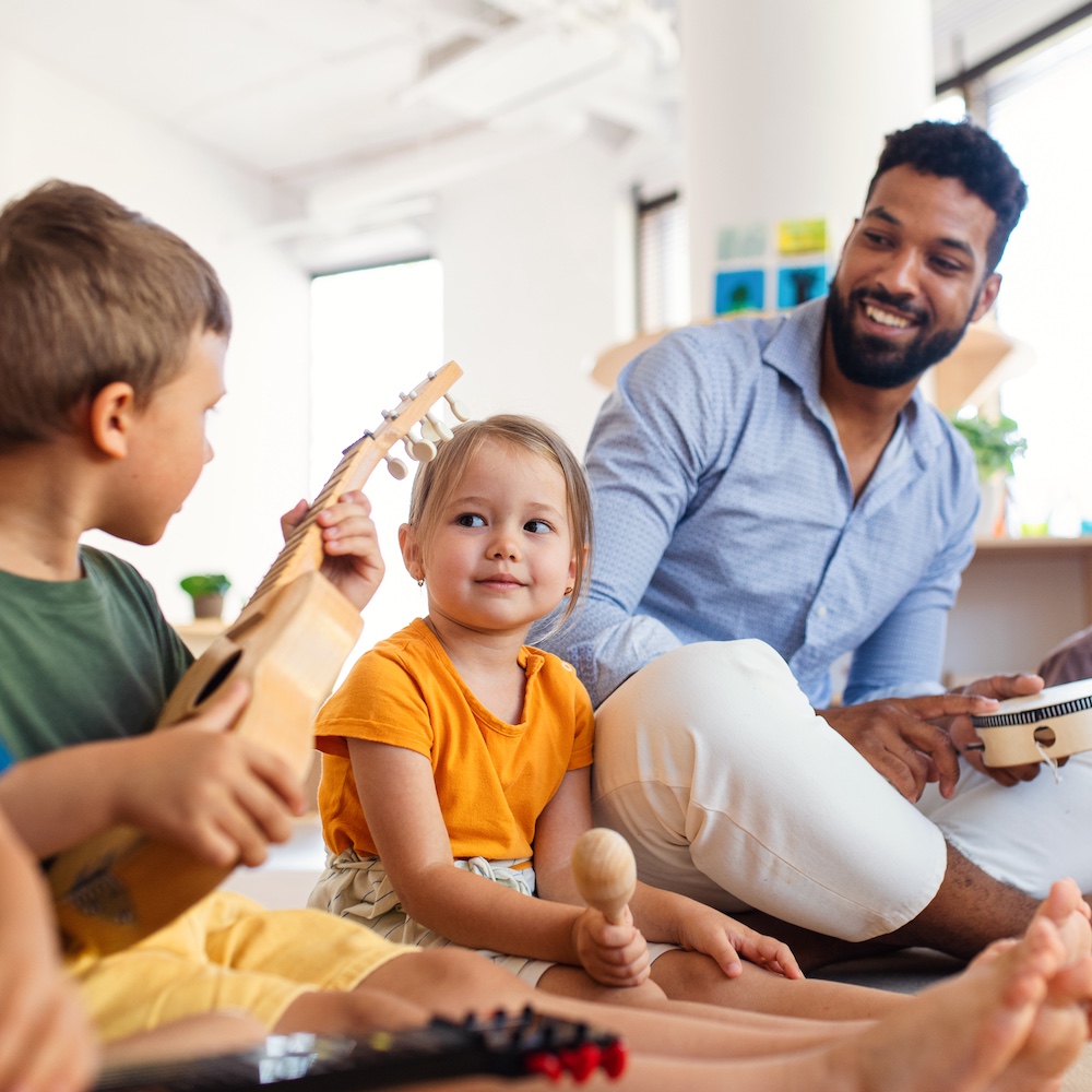 Early Childhood Education Teacher Teaching Music to Young Children