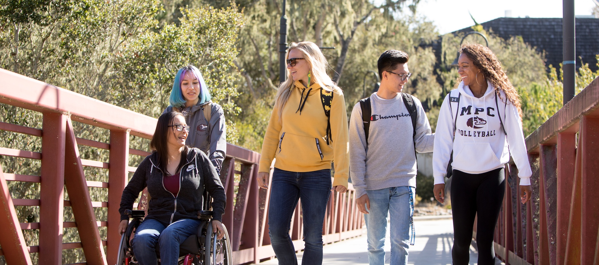 Students crossing bridge on MPC campus