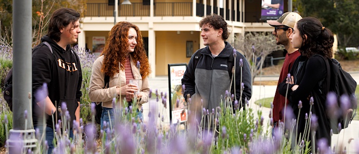 MPC Students Outside on Campus with Flowers