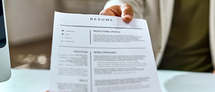 Person Handing Over Resume