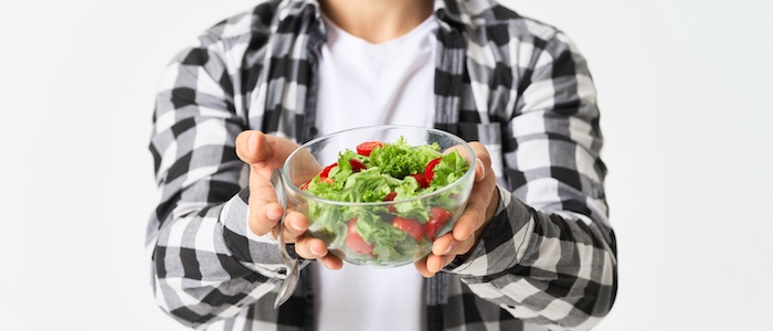 Person Holding Up Salad