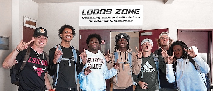 MPC Athletes Posing in Front of the Lobos Zone