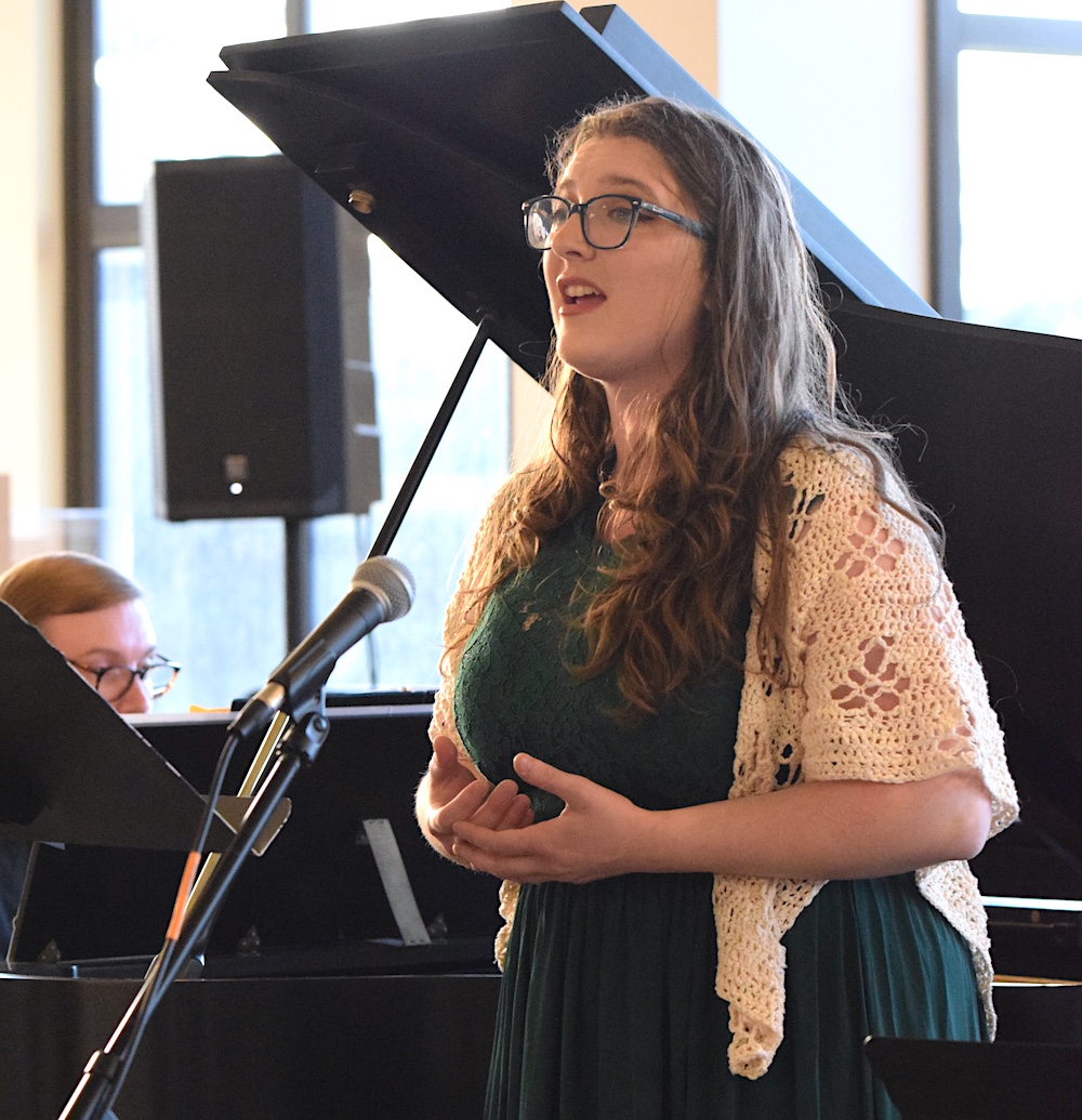 Student Singing with Background Piano at Music in the Stacks