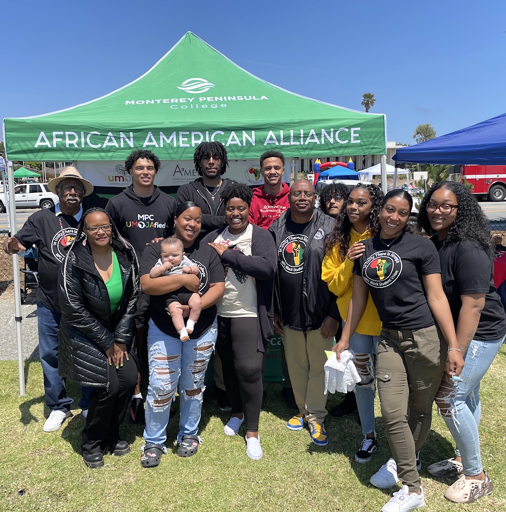 Group Posing in Front of African American Alliance