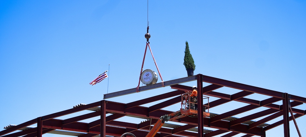 music building final beam being hoisted into place