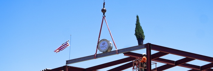 music building final beam being hoisted into place