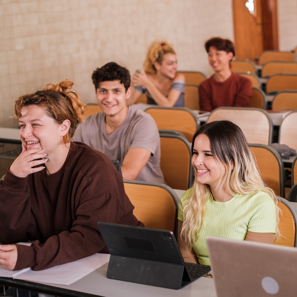 College Students Listening & Laughing in Class