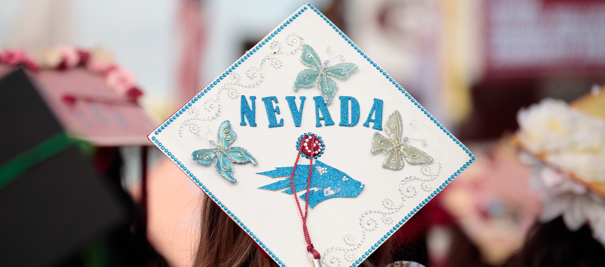 Back of Student Wearing Graduation Cap Decorated to Say Nevada