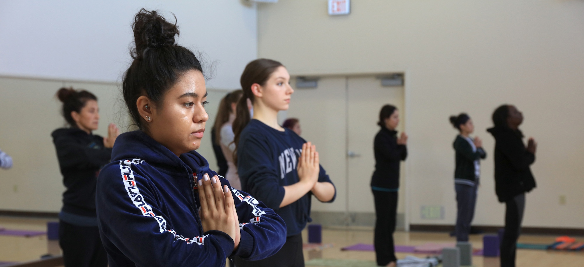 Students in Praying Yoga Pose