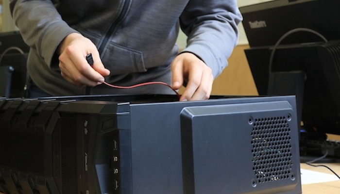 Person Rewiring Computer